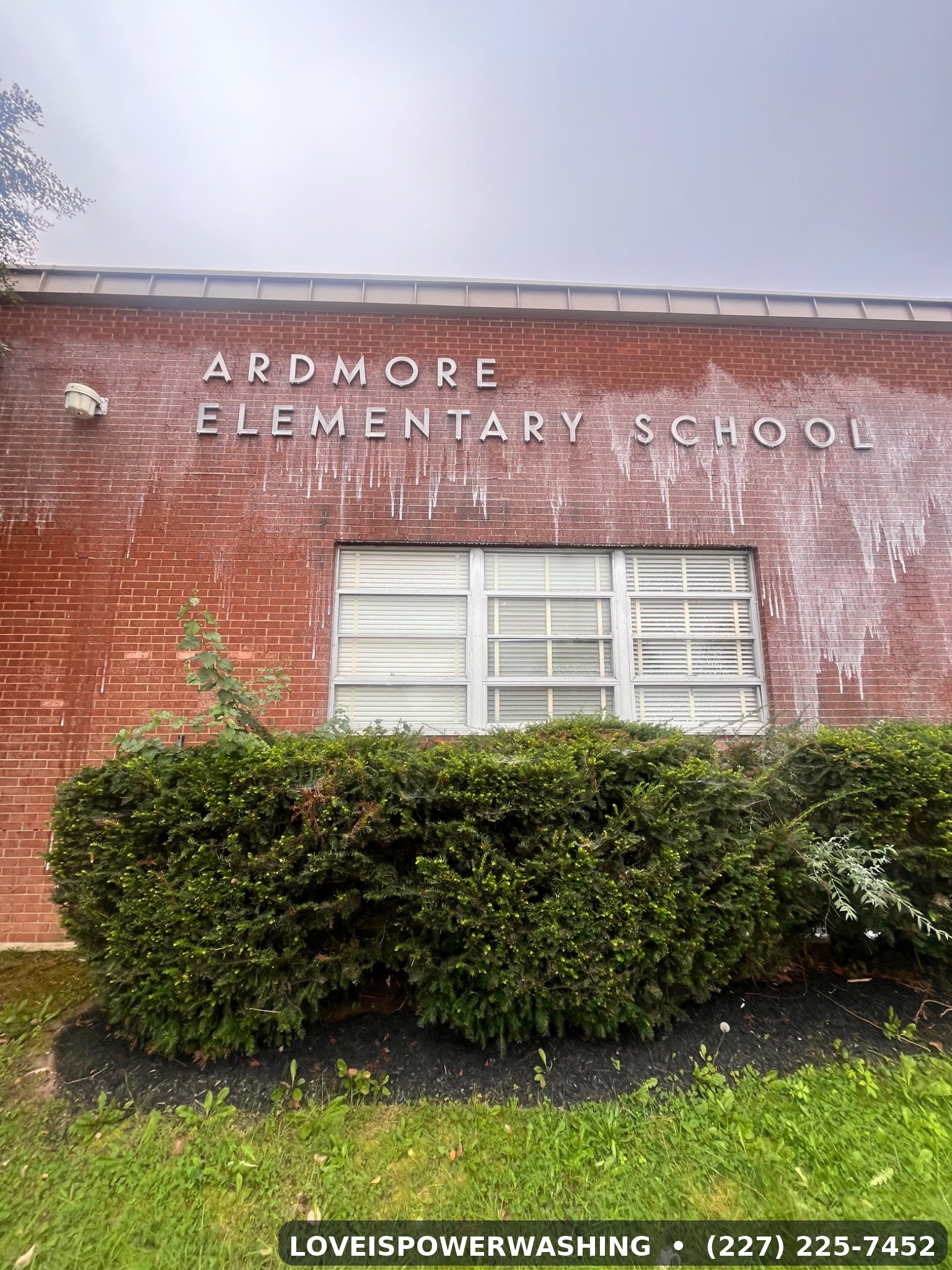 Before: chemical streaks on brick